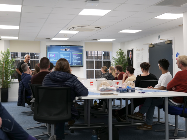 People chatting at a meeting